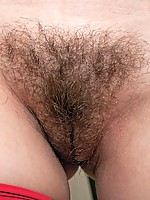 Karina has so much on her mind, like where will she put her suction bottom toy so she can stick it up her hairy pussy! The little table is perfect so